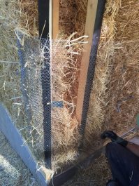 the rest of the corner space stuffed with straw and held with metal lath